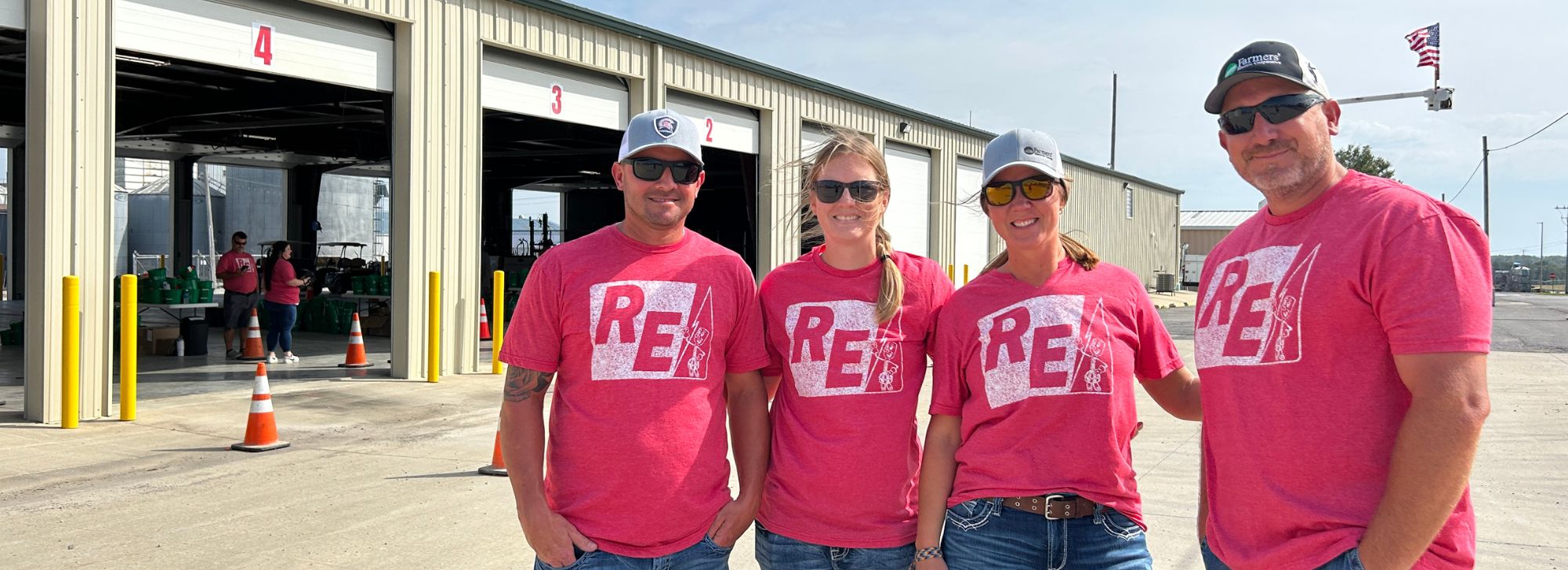 Employees in front of the warehouse at Annual Meeting