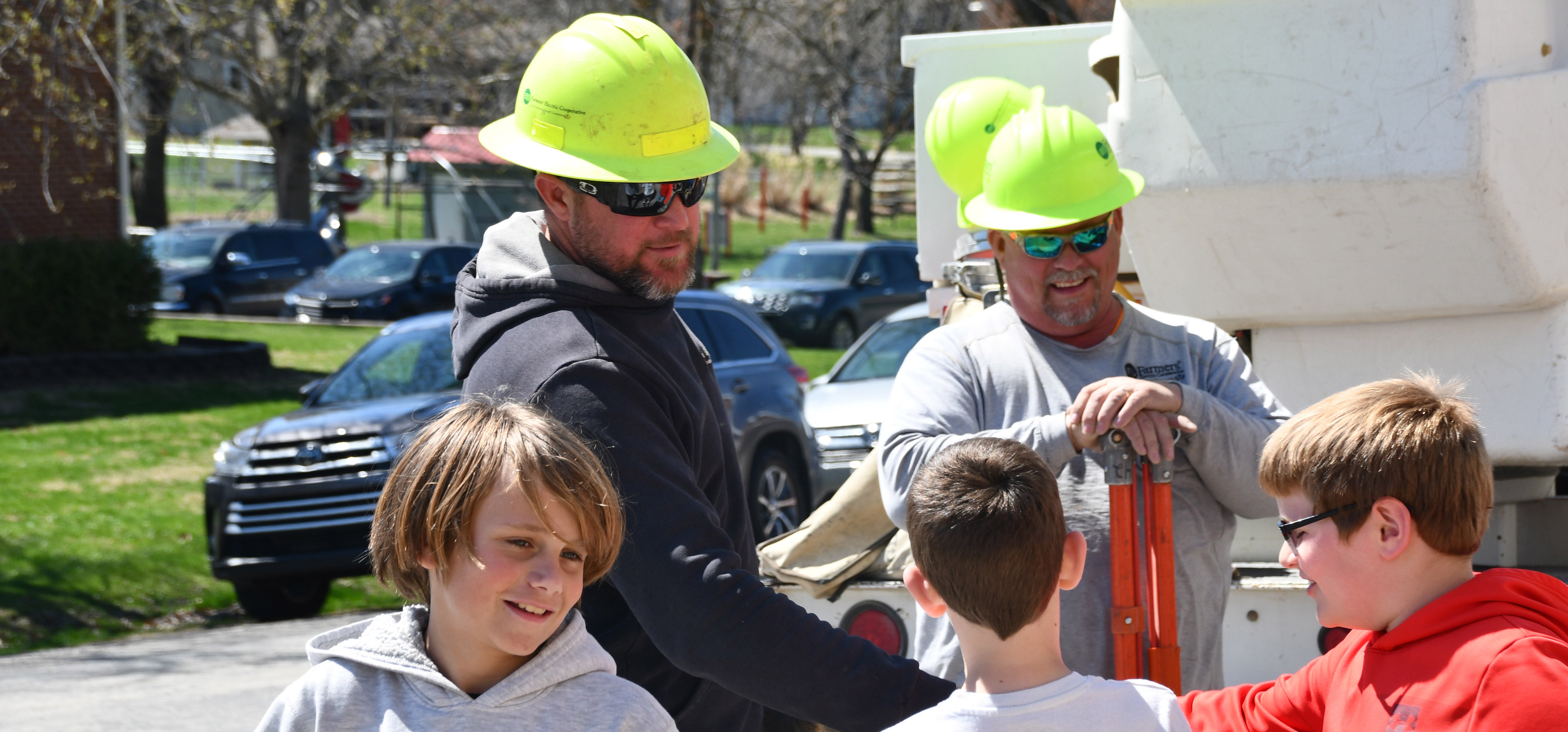 Lineman high-fiving students